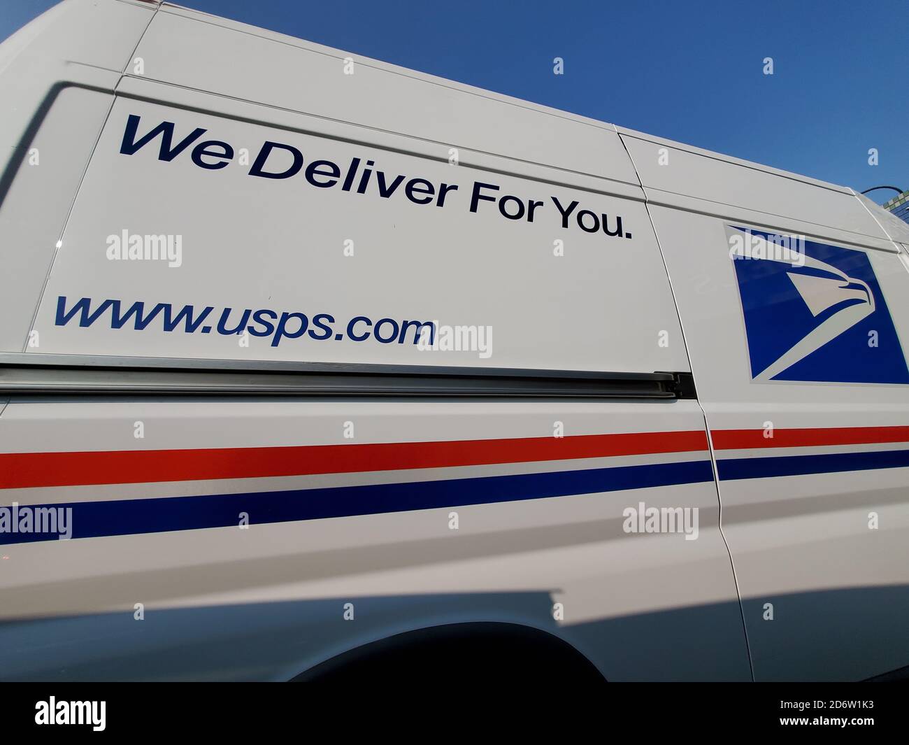 Wide angle view of United States Postal Service (USPS) truck with logo