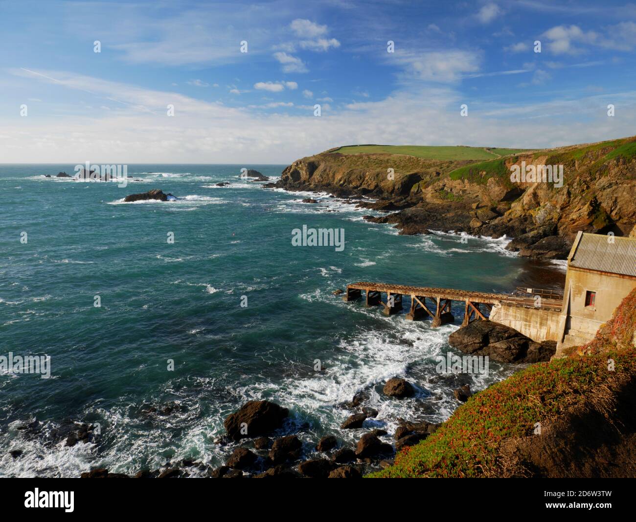 The old lifeboat house at Polpear Cove, The Lizard, on a sunny November day. Stock Photo