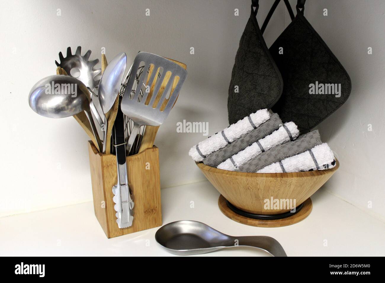 My stainless steel kitchen utensils, hot pads, and dish towels are