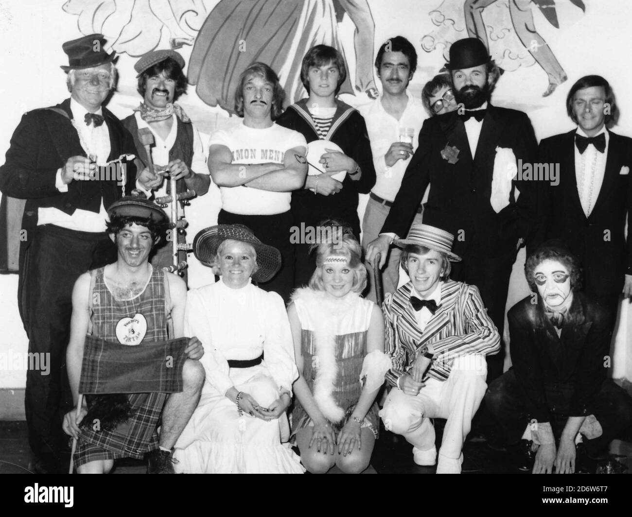 Butlins Filey, North Yorkshire, England, UK. 1975-1977 Archive images of holiday makers & redcoats at Butlins Filey. The entertainment staff would come together on a fridday to perform an Old Time Music Hall. The entertainment manager was Rocky Mason (back row left) who was legendary in his day Stock Photo