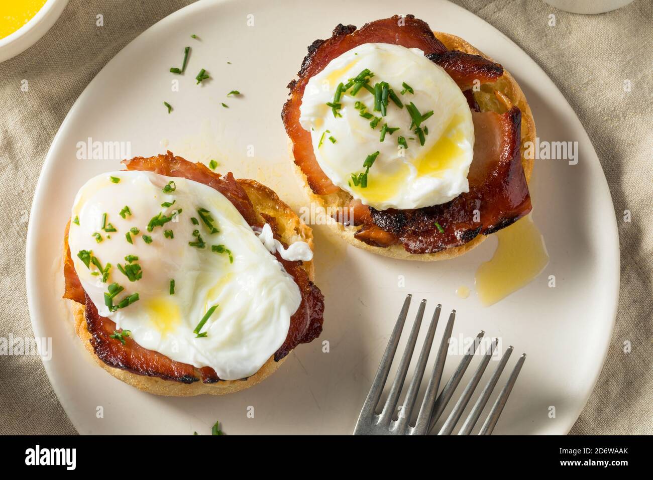 Warm Homemade Eggs Benedict with Ham and Hollandaise Stock Photo Alamy