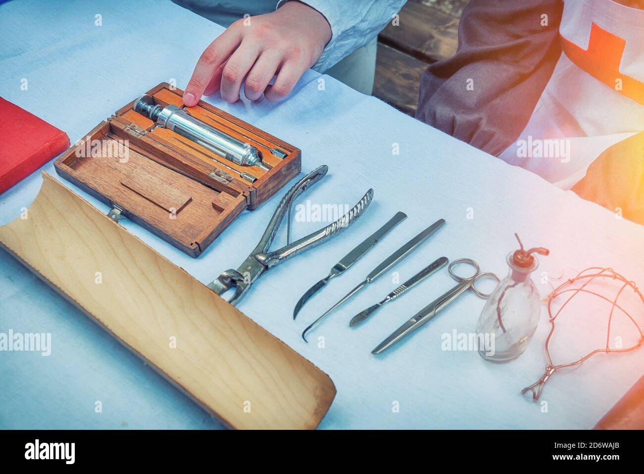 Medical instruments in the field military hospital. Syringe, clamp, scalpel and other tools on the table. Reconstruction of the retro hospital for the Stock Photo