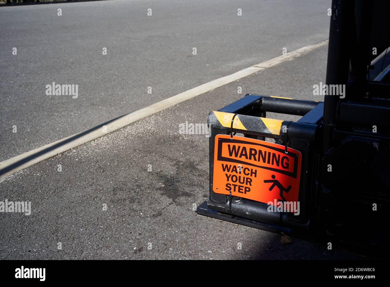 Watch your step warning sign signaling tripping hazard. Stock Photo