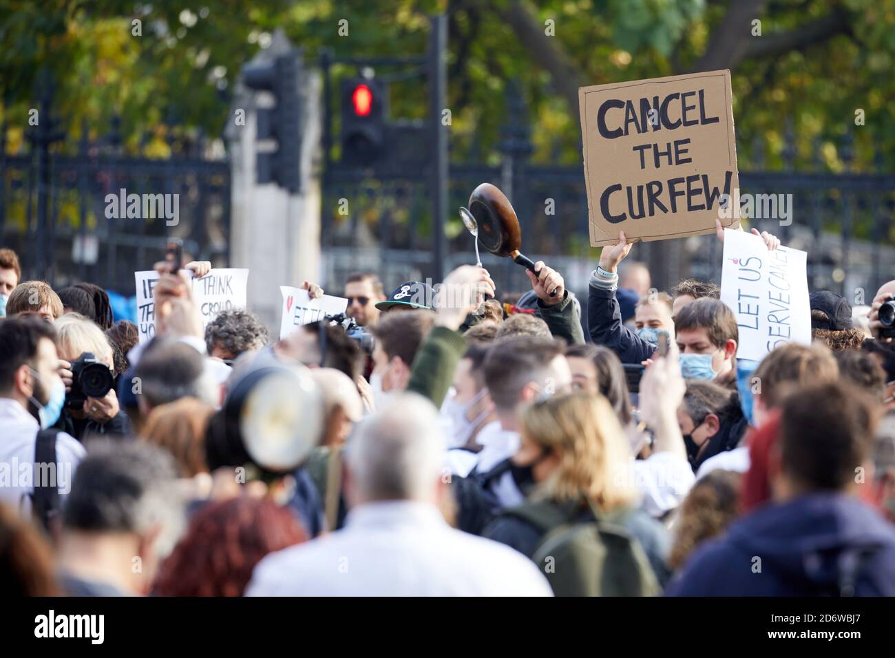 London, UK. - 19 Oct 2020: A placard is held aloft above hospitality workers protesting in Parliament Square against the UK’s coronavirus restrictions, which they say will devastate their industry. Stock Photo