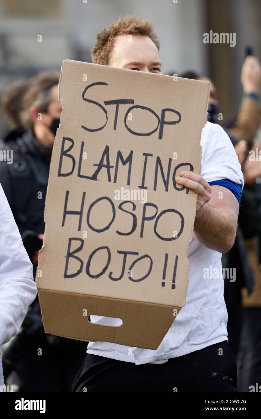 London, UK. - 19 Oct 2020: A hospitality worker holds up a placard during a protest in Parliament Square against the UK’s coronavirus restrictions. Stock Photo