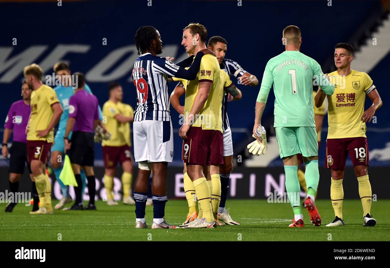 West Bromwich Albion's Romaine Sawyers (left) and Burnley's Chris Wood after the Premier League match at The Hawthorns, West Bromwich. Stock Photo