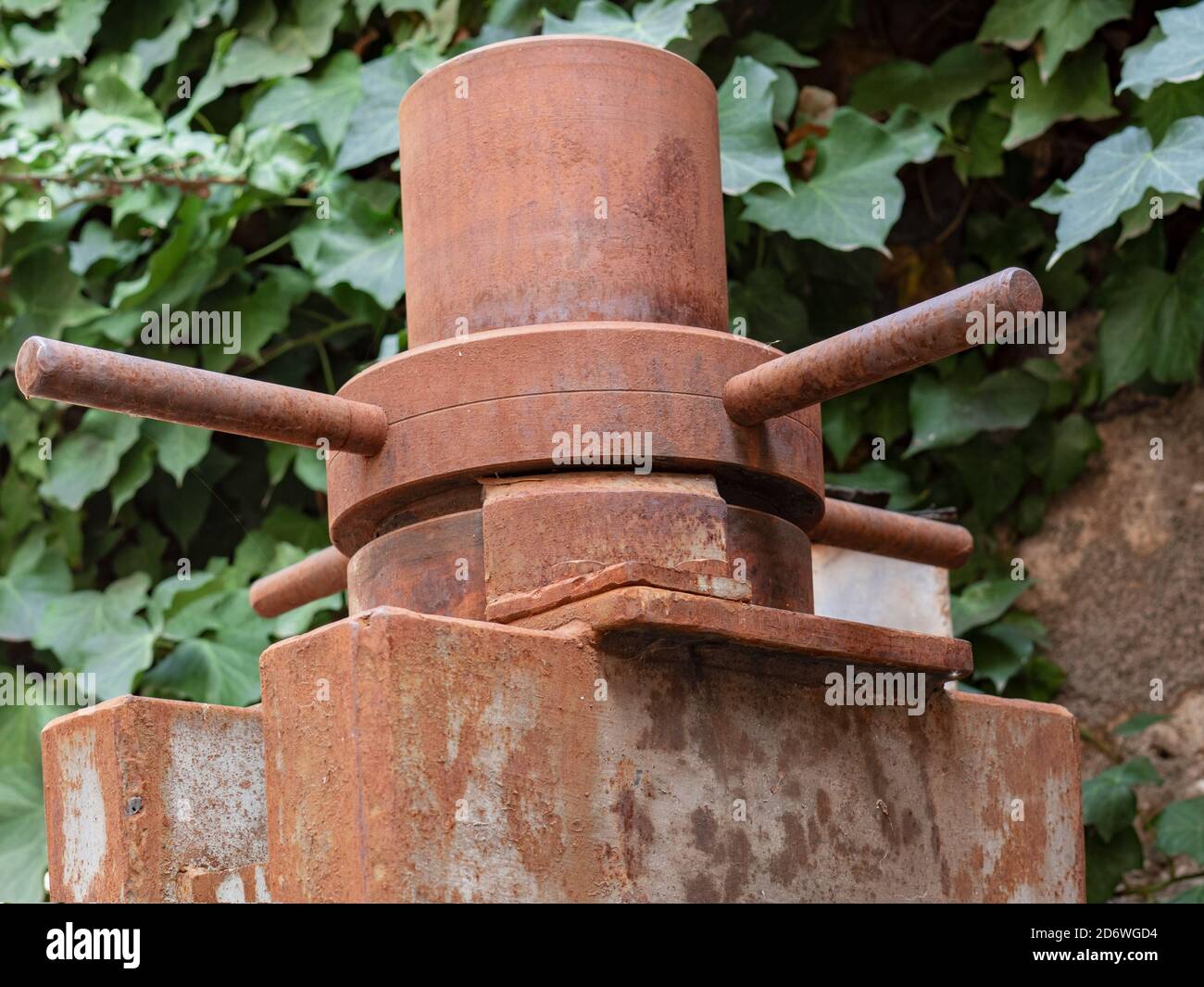Old piece of rusty machinery abandoned in a factory yard Stock Photo