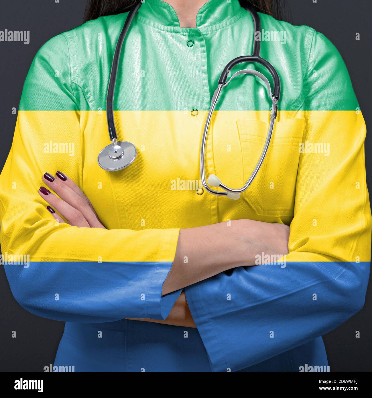 Doctor representing healthcare system with National flag of Gabon Stock