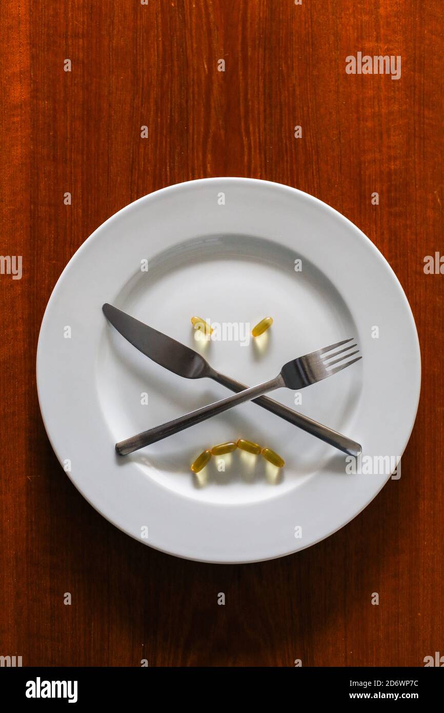 Illustration on food supplements and fasting. Stock Photo