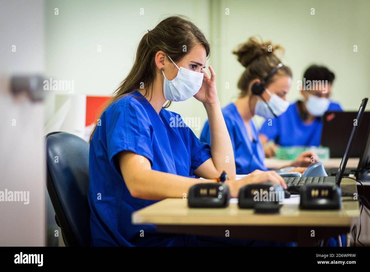 Interns regulating telephone calls. #Coronavirusfrance - COVID-19 Broadband screening platform - Bordeaux University Hospital, France, may 2020. Stock Photo
