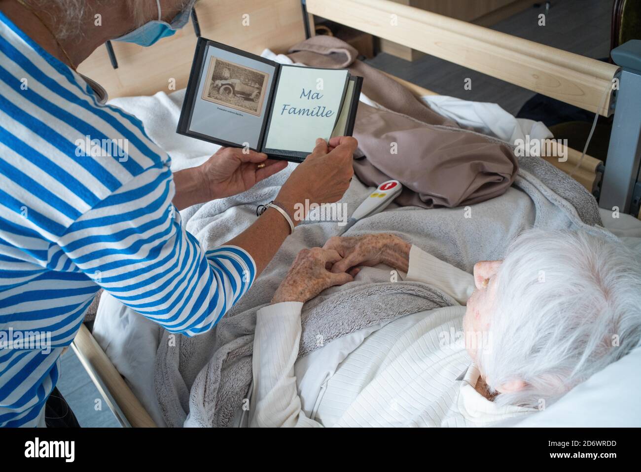 Women looking at old photos, France. Stock Photo