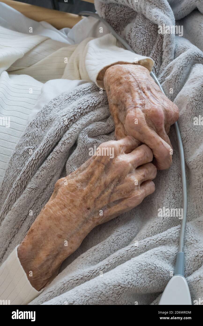 Elderly woman in hospital room, France. Stock Photo