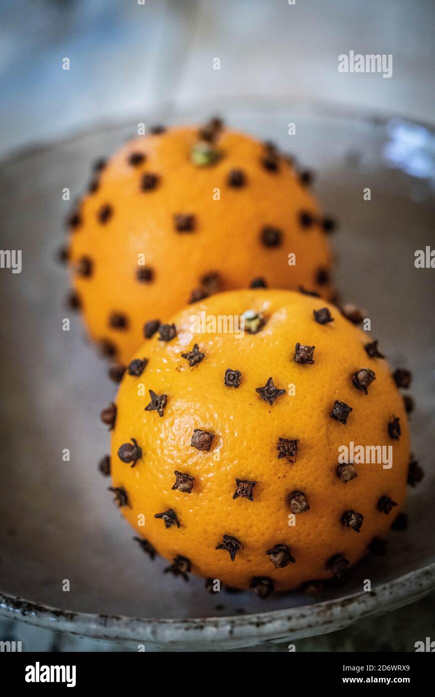 Natural deodorant, sticking cloves into an orange Stock Photo Alamy