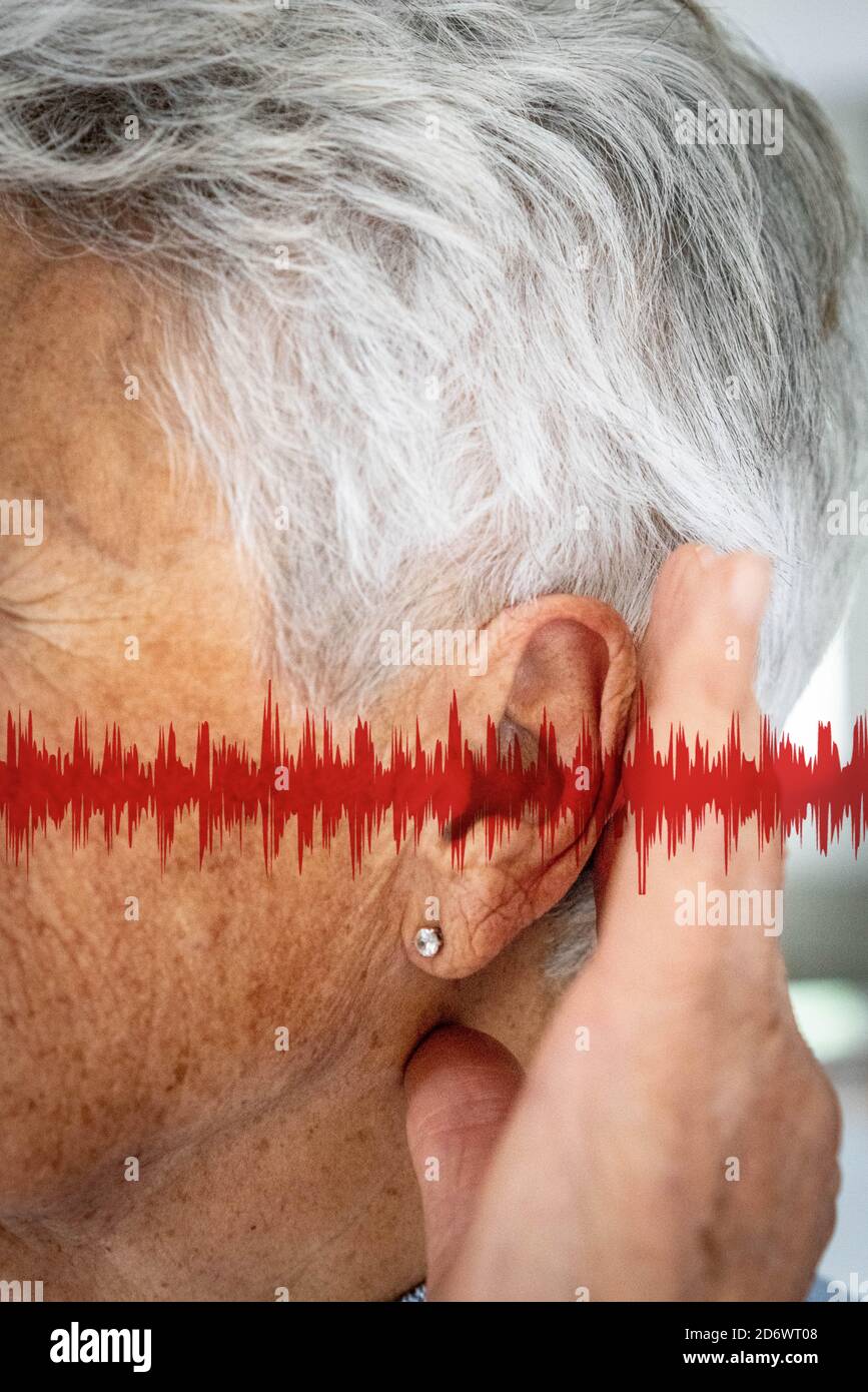 Close-up of the ear of a woman, with graphics representing sound waves. Stock Photo