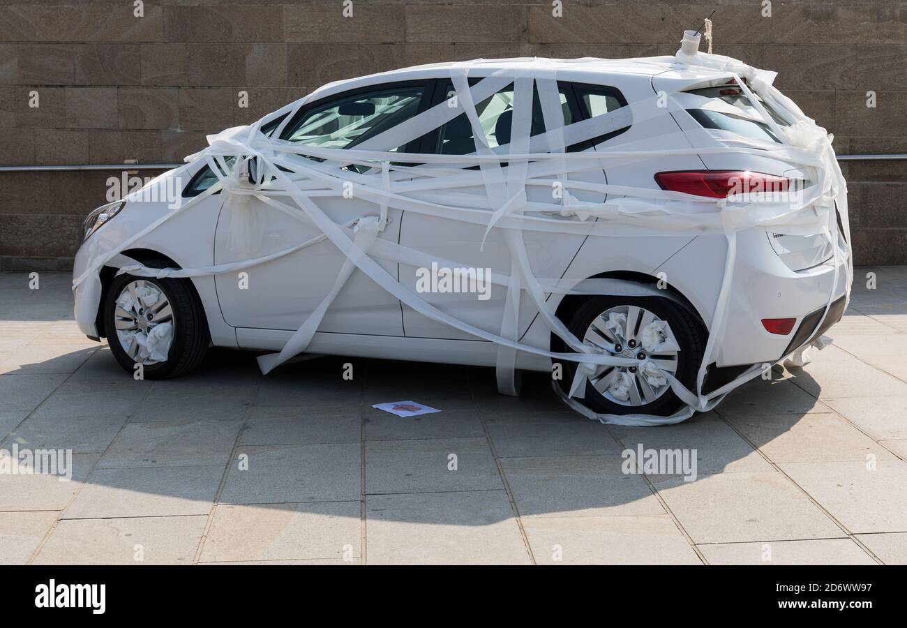 Car wrapped in toilet paper Stock Photo Alamy