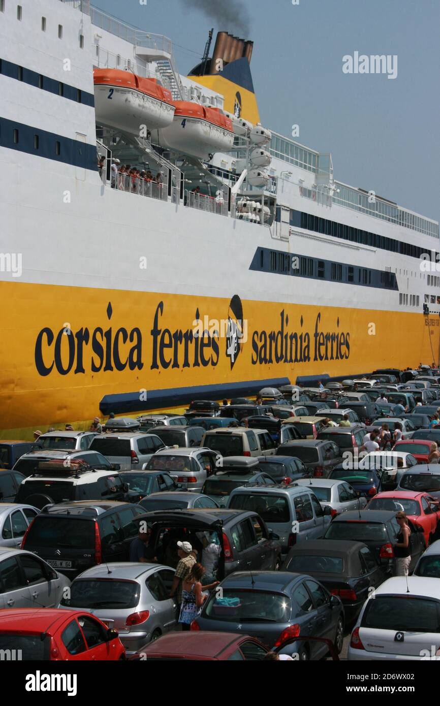 Cars queued to board ferry at Nice, South of France - original image Stock Photo