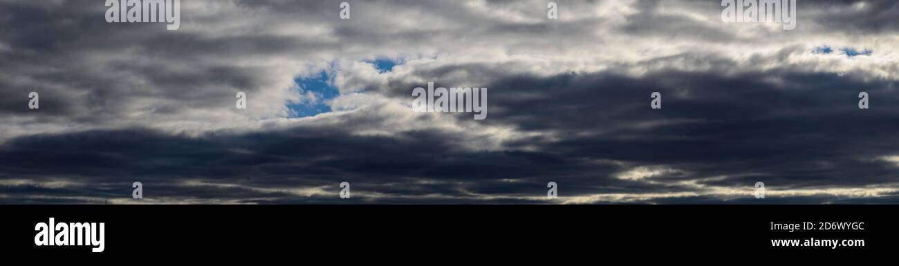 Panorama of gray storm clouds, heavy clouds with autumn rain in the ...