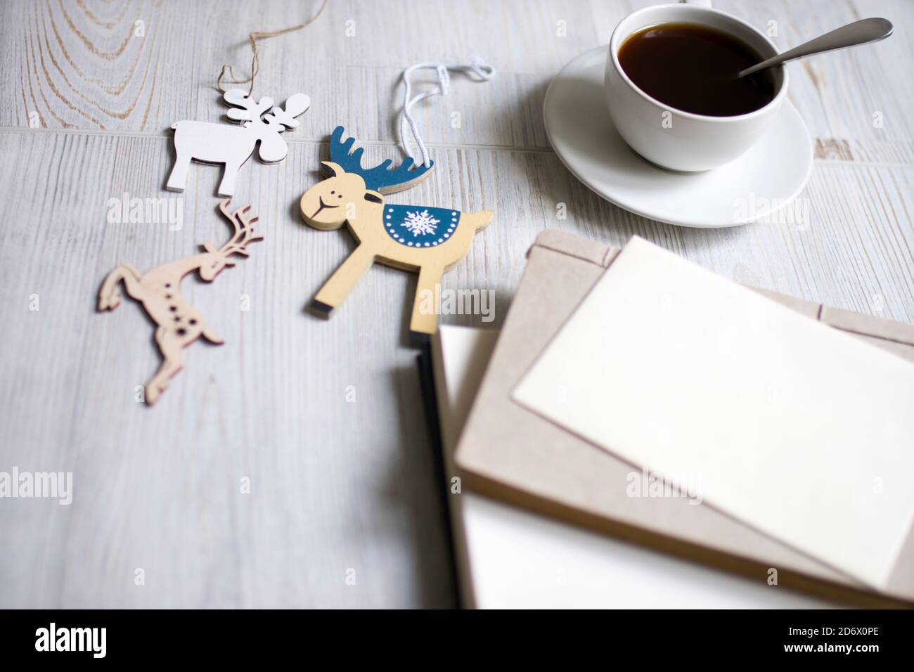 A porcelain cup with coffee on a long empty table. Space for text. Stock Photo