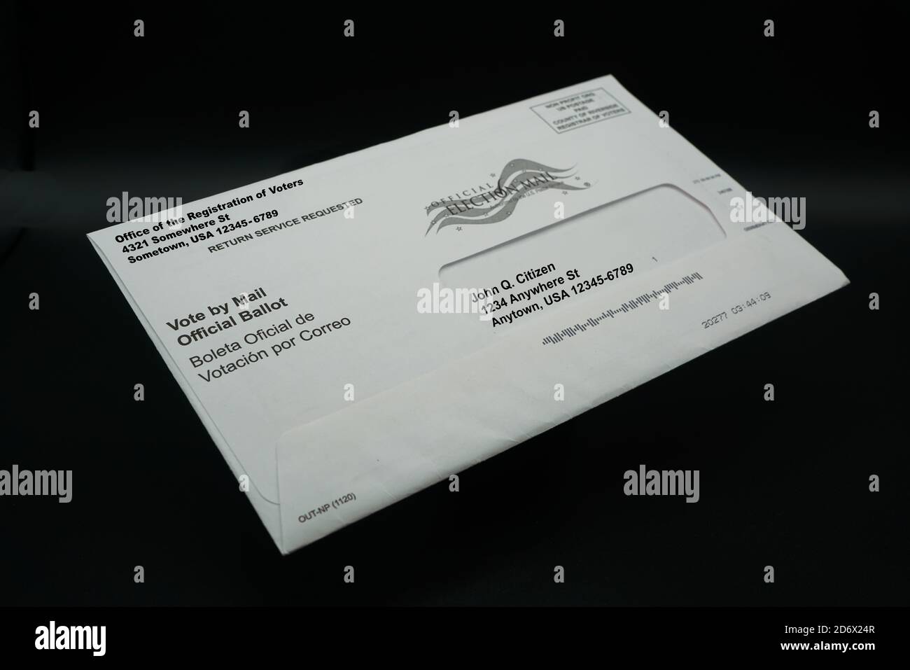 Vote by Mail Ballot Envelope Isolated on Black Stock Photo
