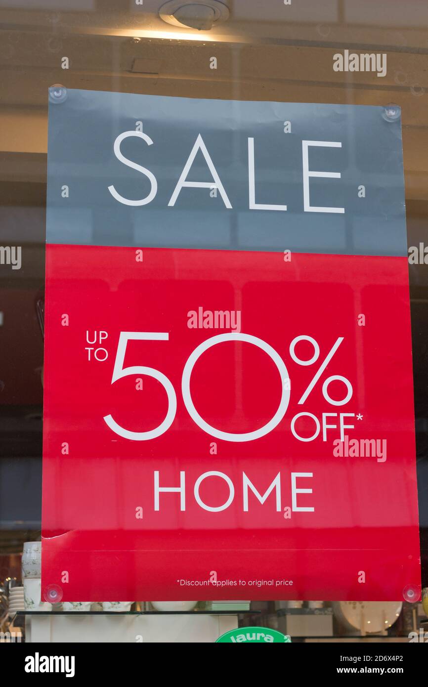 50% off sale poster hanging on shop window Stock Photo