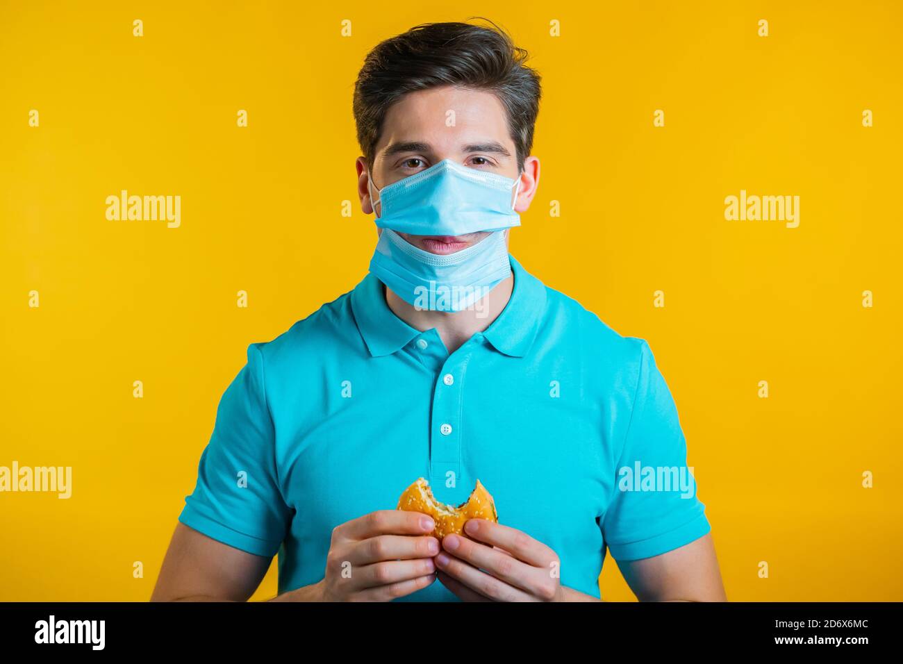 Fat man eating hamburger on hires stock photography and images Alamy
