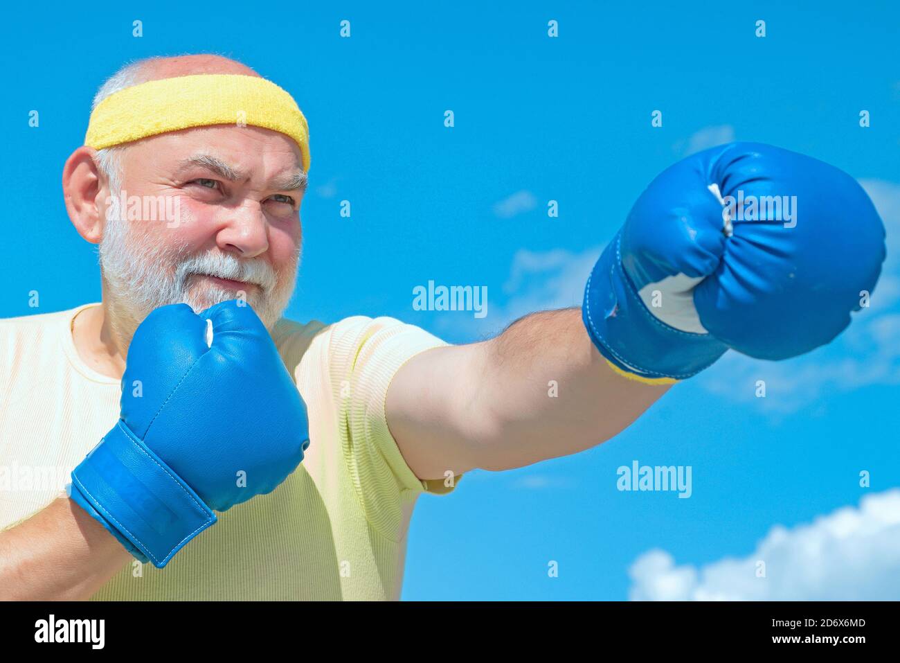 Senior sportive man in boxing stance doing exercises with boxing gloves.  Active leisure. Best cardio workout Stock Photo - Alamy