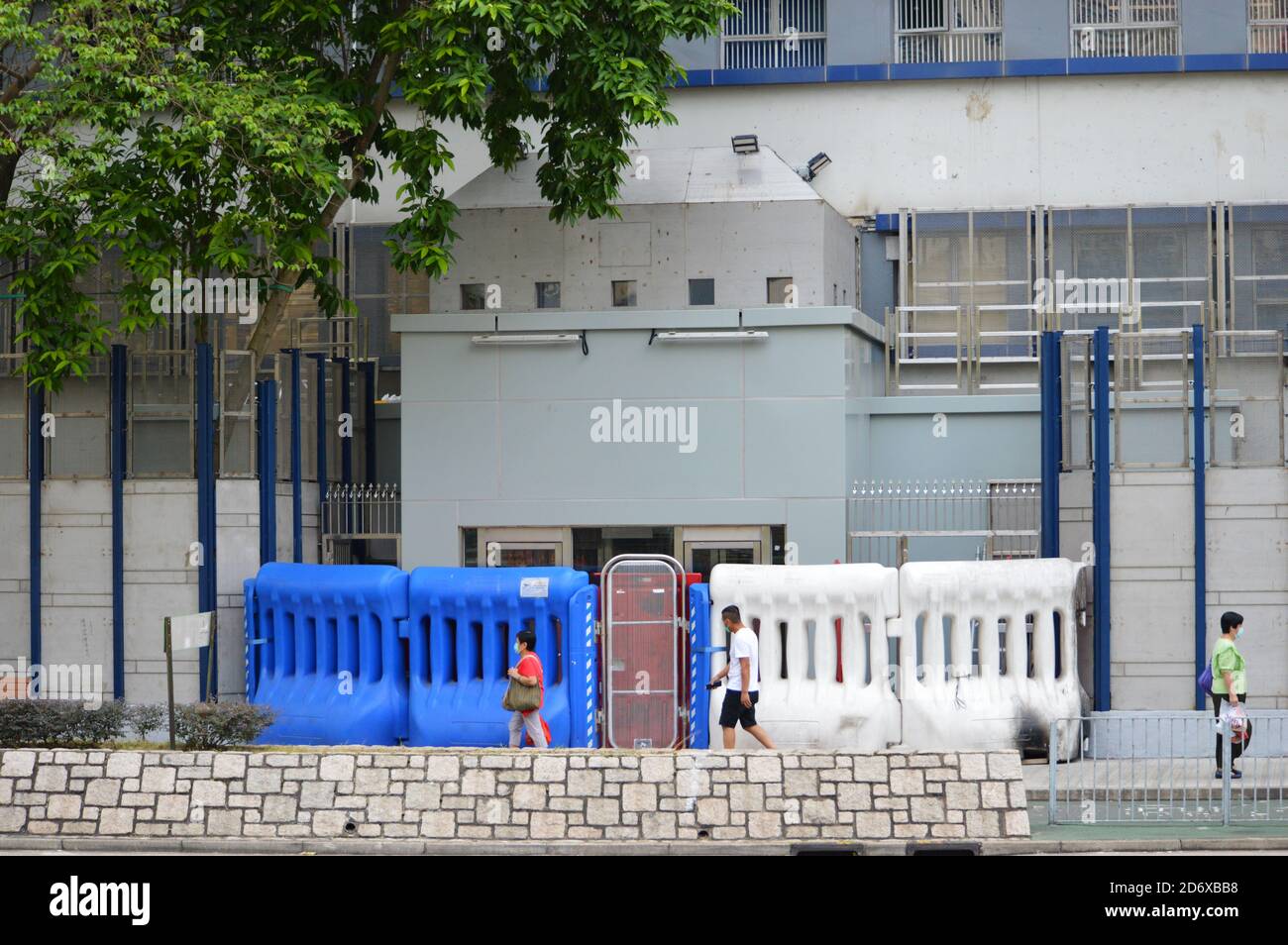 Entrance of Tin Shui Wai Police Station, with water barriers following 2019-20 protests Stock Photo