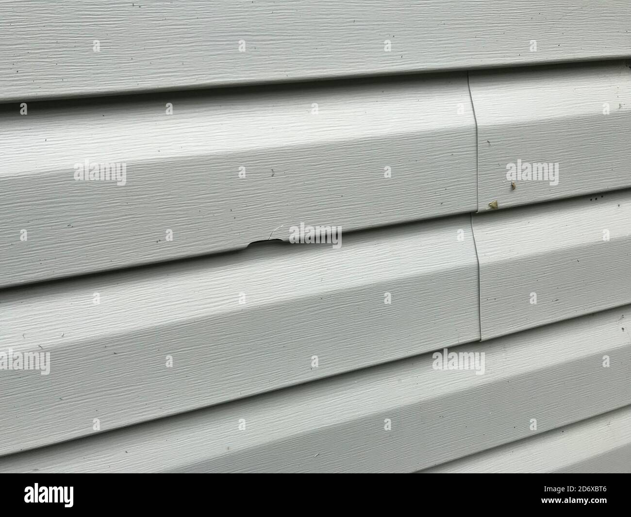 Exterior Vinyl Siding Damaged By Hail, Wind, Hailstorm Stock Photo Alamy
