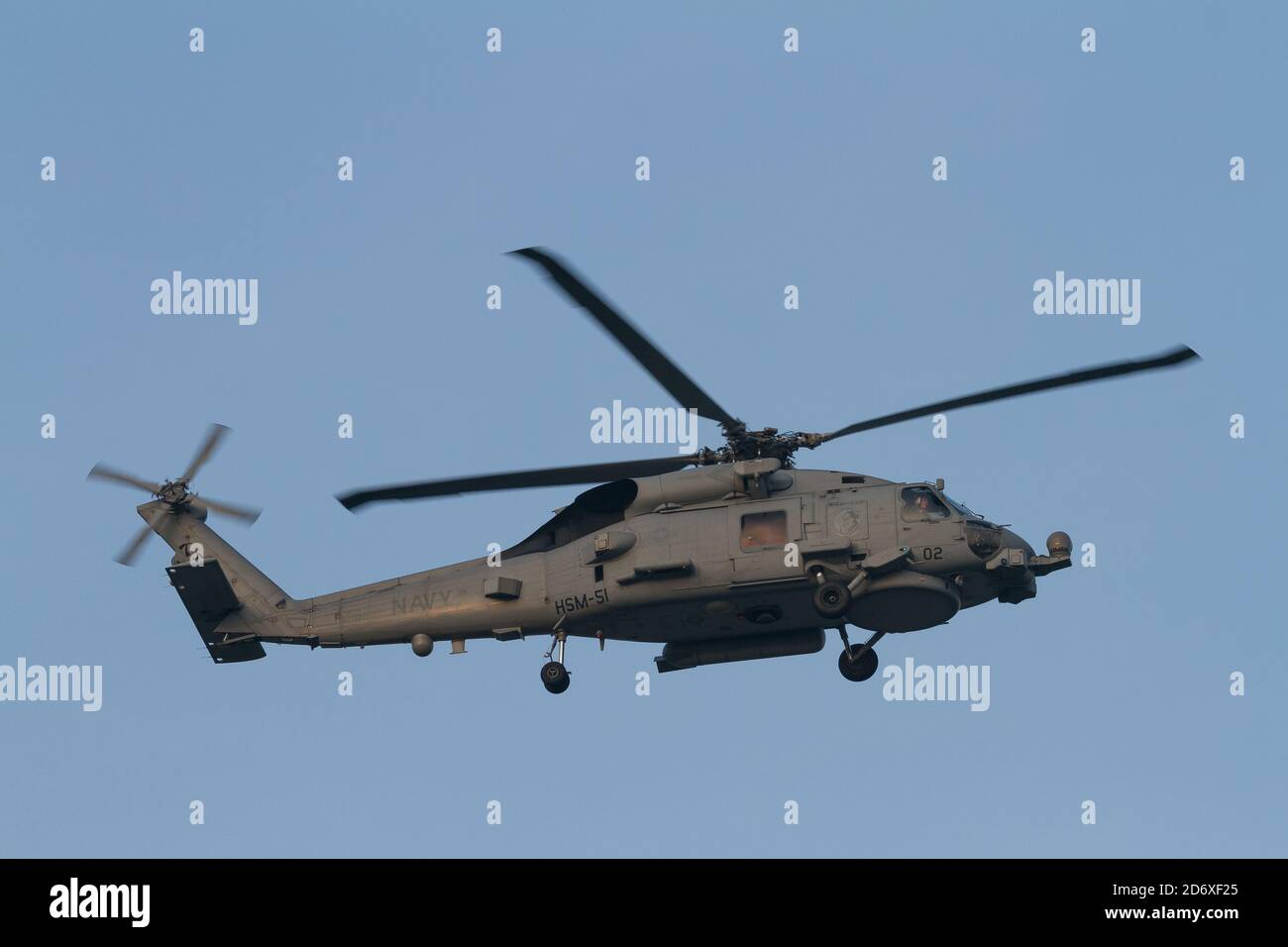 A Sikorsky SH-60 Seahawk helicopter, of Carrier Air Wing Five, flying near Naval Air Facility, Atsugi airbase, Kanagawa, Japan. Stock Photo