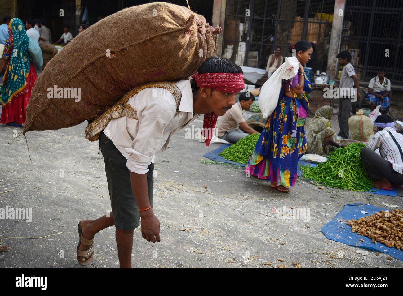 Manual Worker carrying Potato sack on his back Stock Photo Alamy
