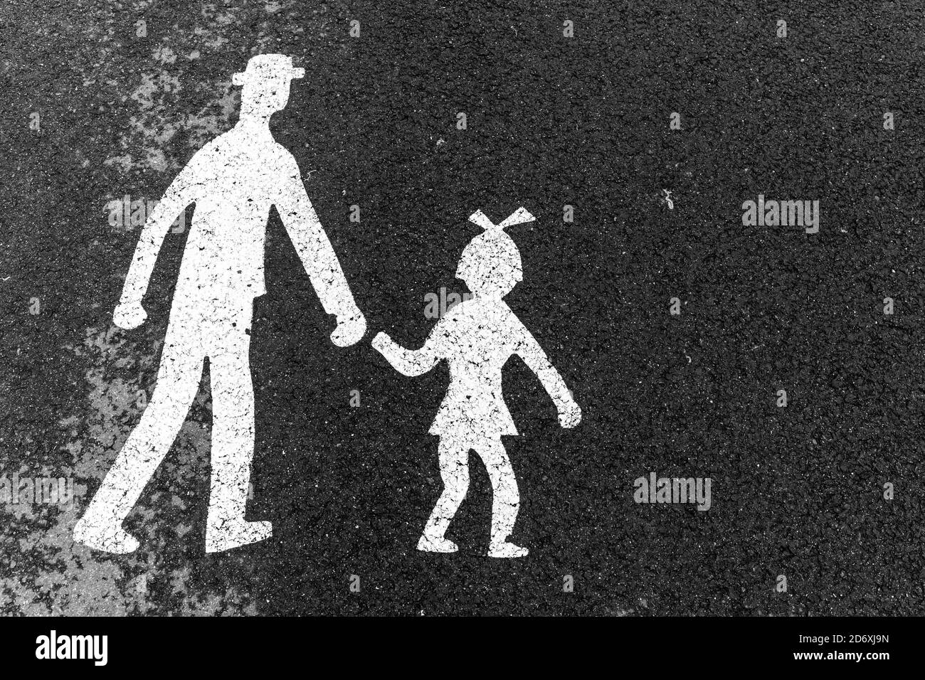 Pedestrian path  in Czech Republic in the city Tisnov. Man and girl on asphalt. Pedestrian symbol. Stock Photo