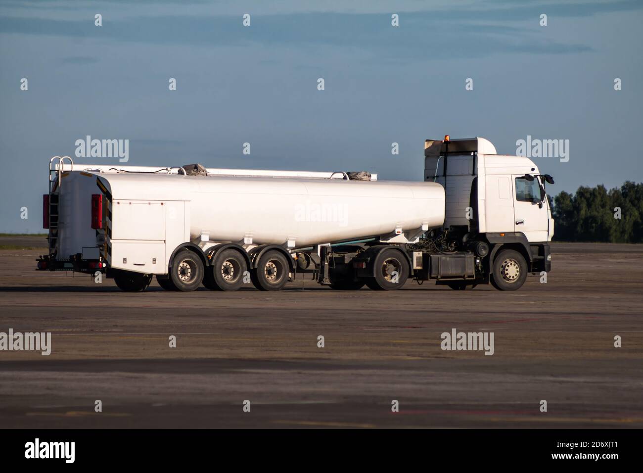 White tank truck aircraft refueler at the airport apron Stock Photo - Alamy