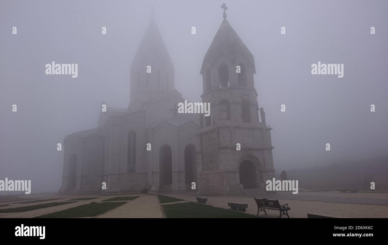 An apostolic Ghazanchetsots Cathedral almost completely hidden by fog in Shushi, Republic of Artsakh Stock Photo