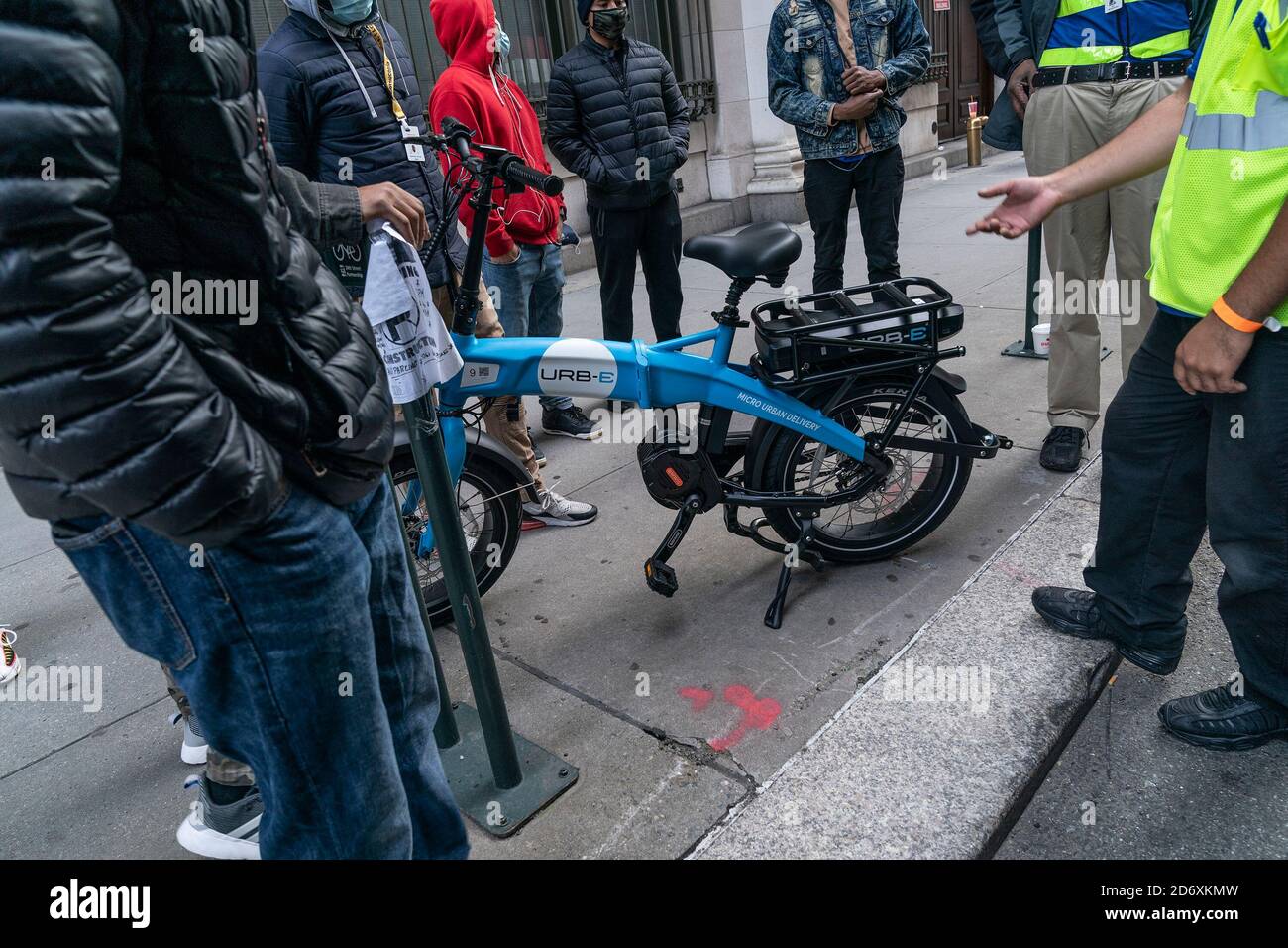 Amazon employees receive lesson on usage of Urb-E bikes for delivery in New  York. In order to make delivery more efficient and reduce greenhouse gas  emissions by cars Amazon will start delivery