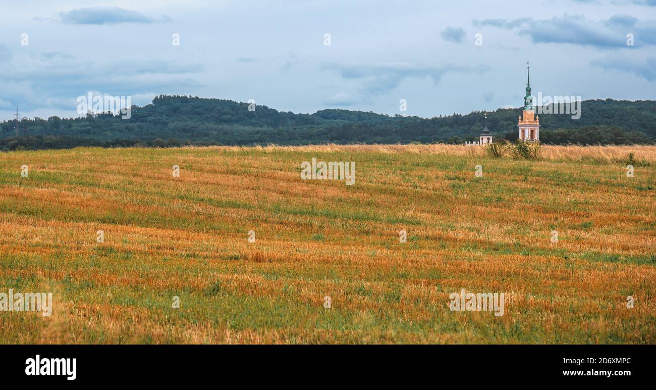 Agricultural field under cloudy sky Stock Photo - Alamy
