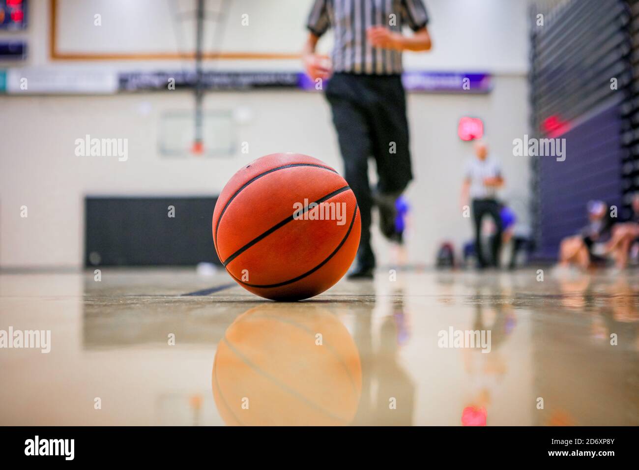 Selective focus shot of a basketball rolling in the hardcourt referee Stock  Photo - Alamy