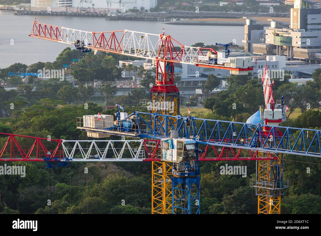 Aerial view of four tower cranes cluster together on the construction site. Stock Photo