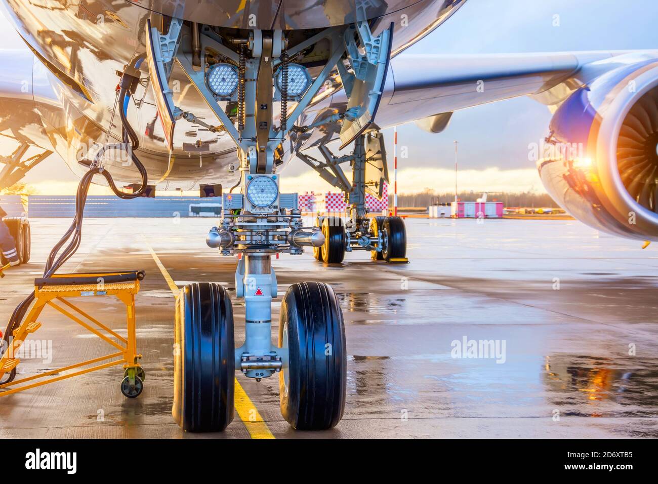 Front landing gear landing lights and connected ground power under the