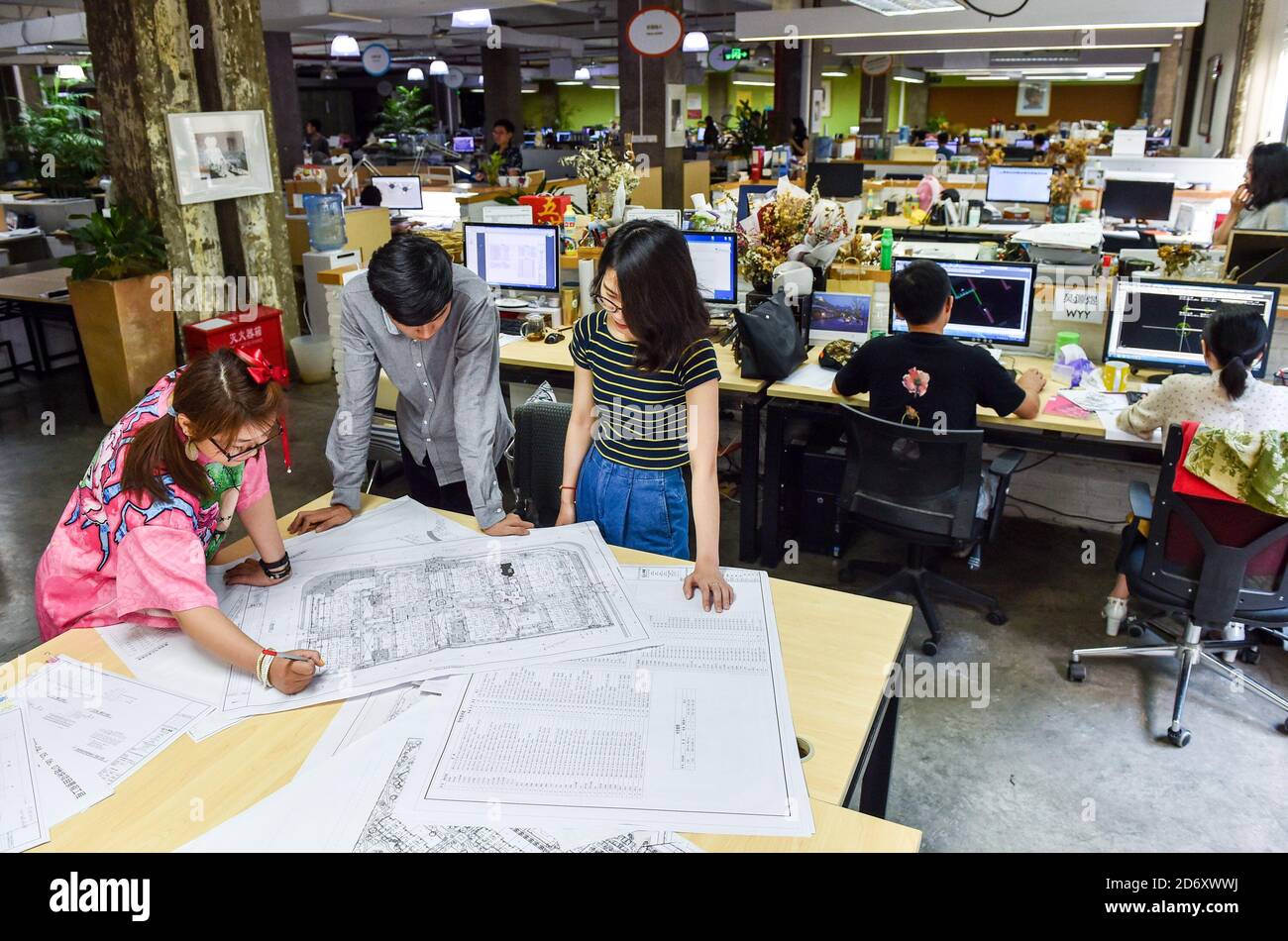 (201020) -- SHENZHEN, Oct. 20, 2020 (Xinhua) -- Landscape designers work at L&A Design, a cultural and creative company, in Shenzhen, south China's Guangdong Province, June 20, 2018. Along with 40 years of rapid economic growth, Shenzhen, China's first and most successful special economic zone, has also achieved cultural prosperity. As early as 2003, Shenzhen took the lead in proposing the strategy of making the city culture-nurtured. In 2008, Shenzhen was designated as a UNESCO City of Design, clarifying the transformation of strategic development goal from promoting manufacturing economy to Stock Photo