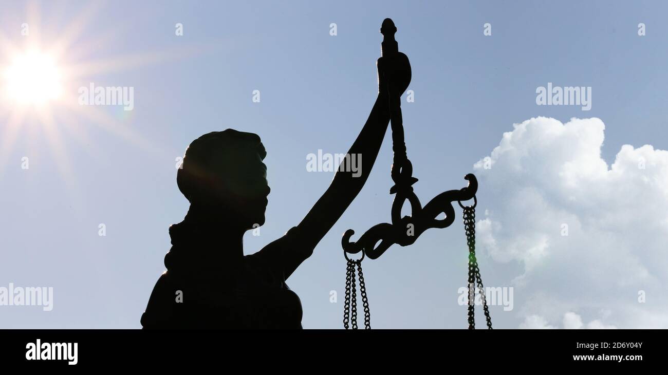 Close-up of a Justitia in front of a blue sky Stock Photo