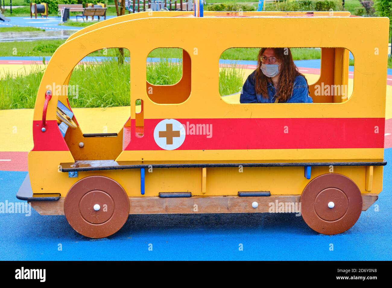 mom-baby-sitting-in-toy-ambulance-at-the-playground-stock-photo-alamy