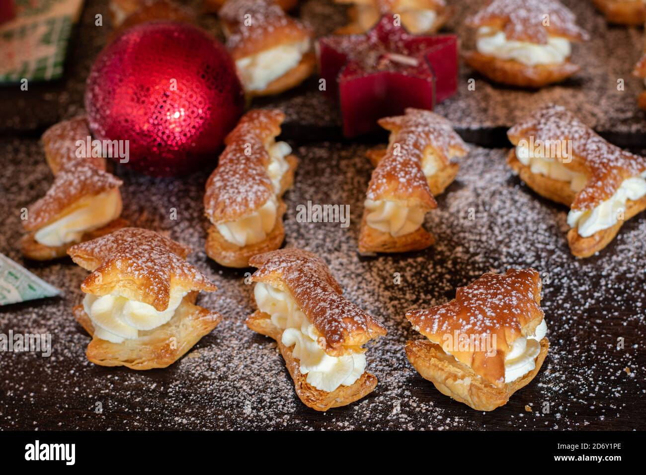 christmas eclairs on wooden background Stock Photo