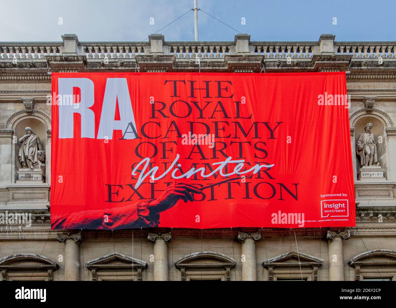 Large red banner advertising the RA Summer (Winter) Exhibition at the