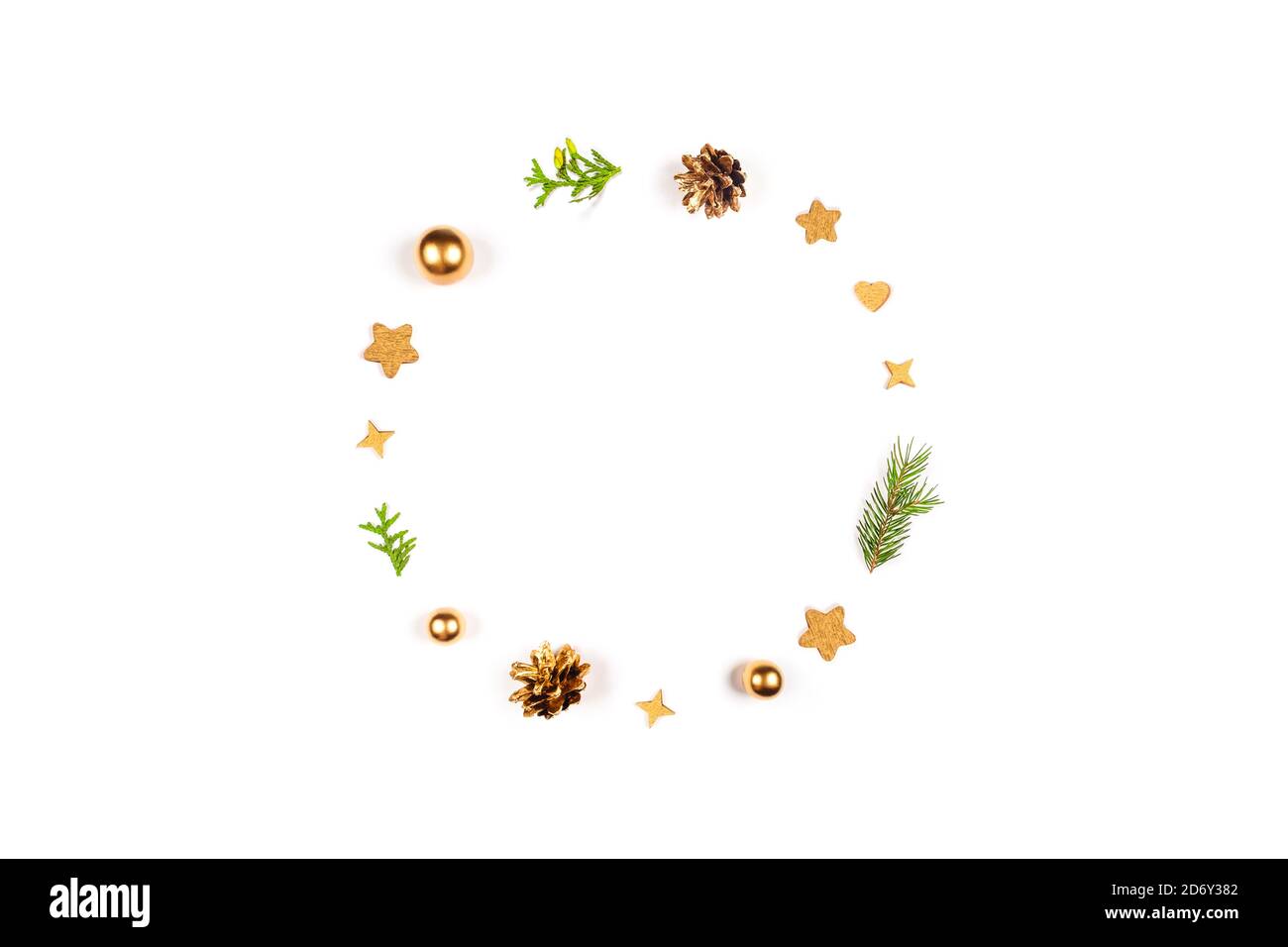 Christmas decorations are laid out in the shape of a circle on a white isolated background. Stock Photo