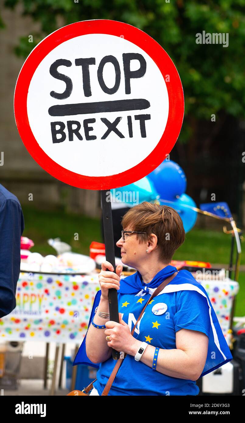 Anti-Brexit campaign protester with sign outside the Houses of Parliament, London, in protest of the UK leaving the European Union.. Stock Photo