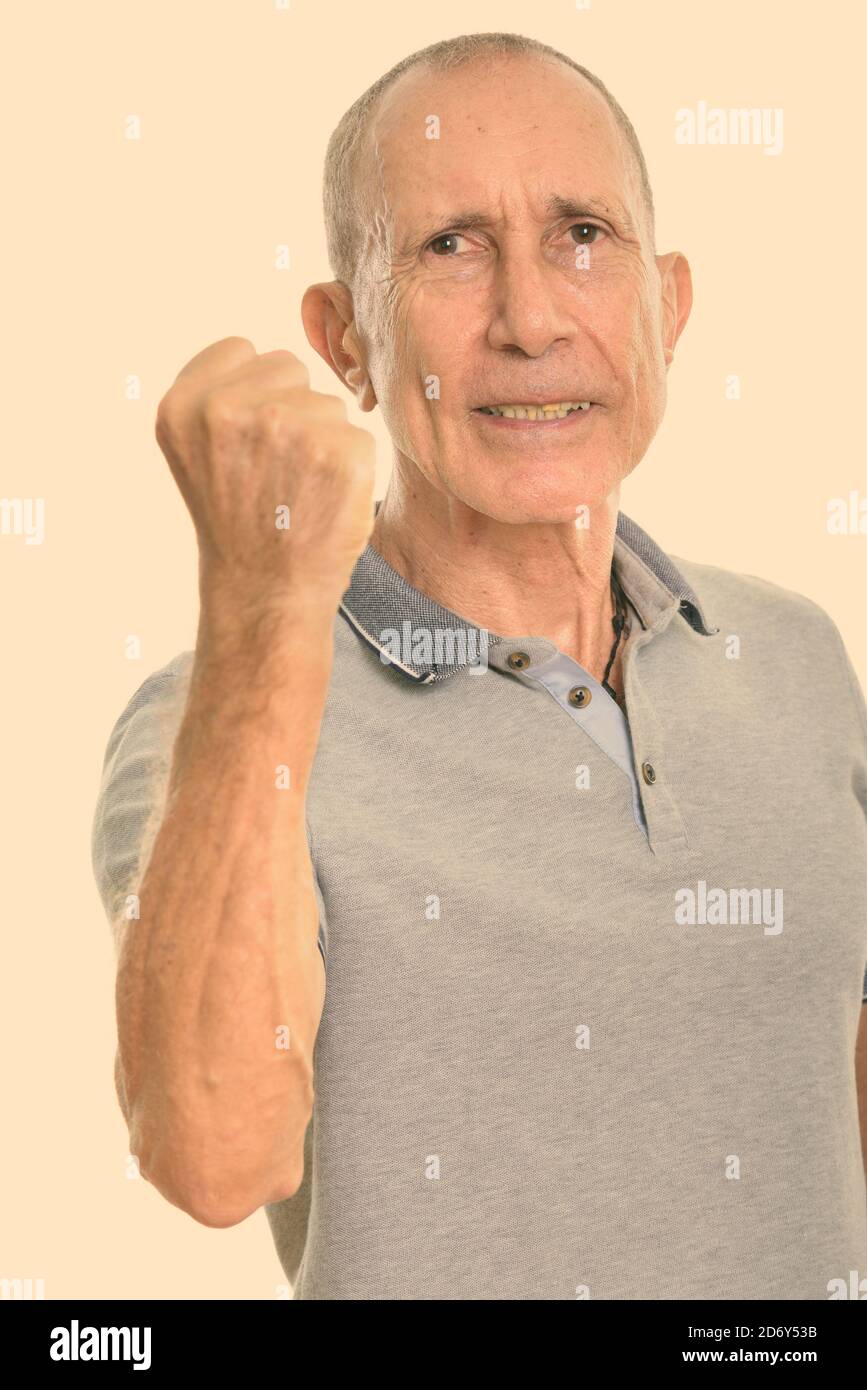 Old man with raised arm hires stock photography and images Alamy