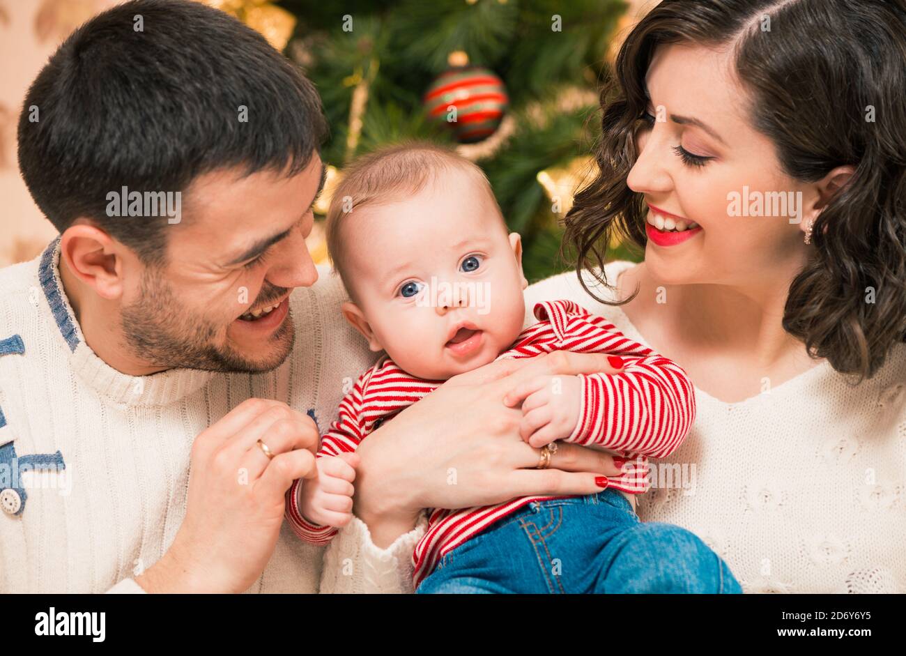 happy young family portraits at holiday background Stock Photo