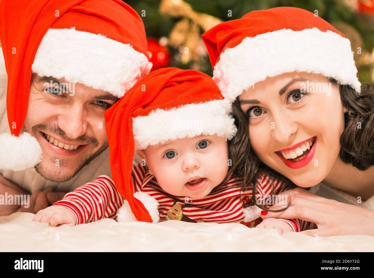 happy young family portraits at holiday background Stock Photo