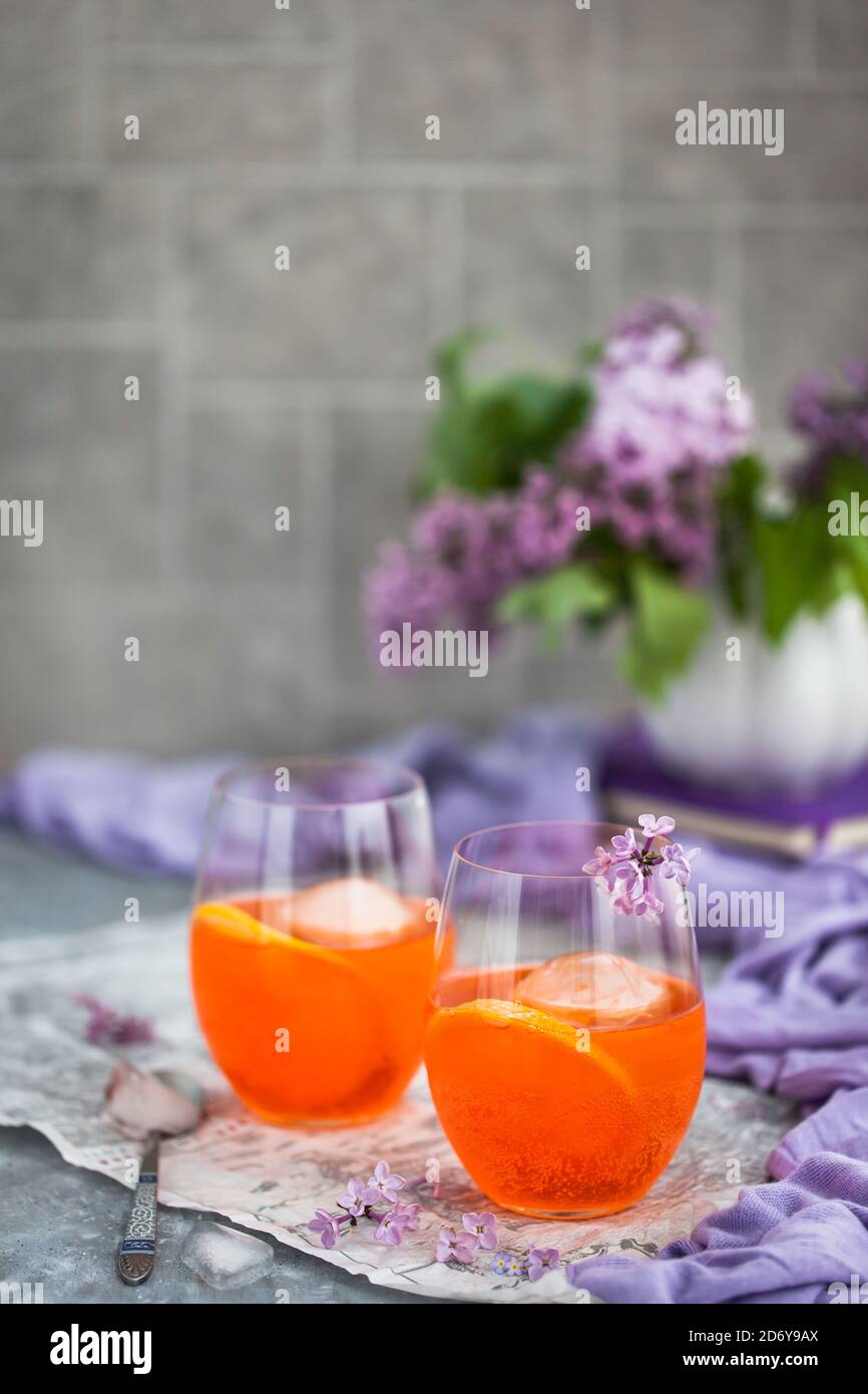 Orange Aperol Spritz cocktail served in a wine glasses, decorated with ...