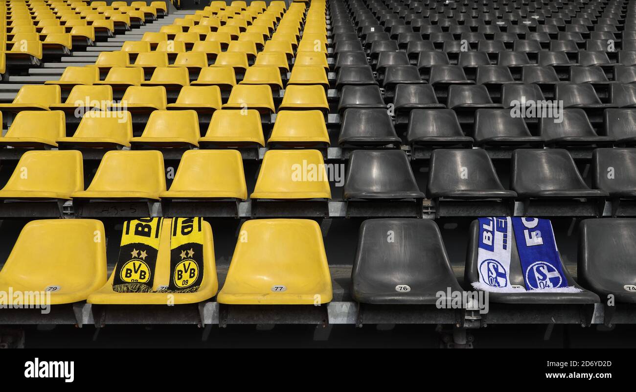 Dortmund, Deutschland. 08th May, 2020. firo: 08.05.2020, football, 1st Bundesliga, 2019/2020 season, BVB, Borussia Dortmund, SIGNAL IDUNA PARK stadium, before DERBY, Revierderby BVB - Schalke 04, restart of the Bundesliga after interruption by CORONA, COVID-19, scarves of the two clubs BVB and Schalke on the empty seat shells, with distance, seats, empty range, ghost game, no spectators, | usage worldwide Credit: dpa/Alamy Live News Stock Photo